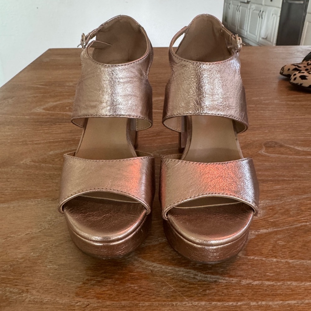 Naturalizer platforms in metallic gold.